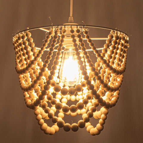 Wood Beaded Plug In Chandelier Lighting 1 Light Beaded Chandelier Boho Ceiling Fixture glowing with warm light