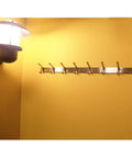Heavy Duty 304 Stainless Steel Coat Rack Rail With Six Hooks Brushed Finish Wall Mount Towel Hook Bar installed on yellow wall