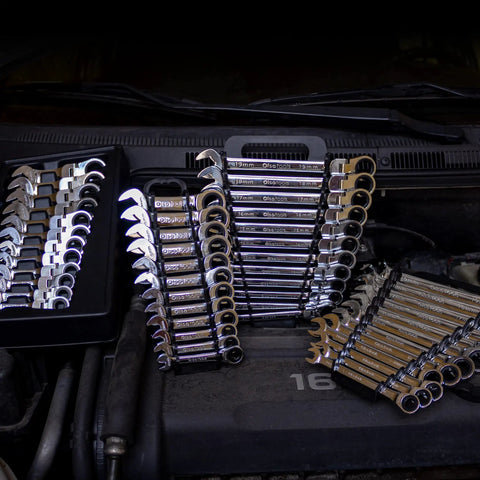 Flex Head Ratcheting Wrench Set 12 Piece Metric Six Point Box End With 120 Tooth Precision Gear arranged on car engine