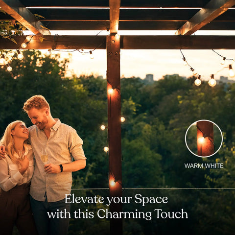 Couple under a pergola with solar powered LED outdoor string lights 27 ft warm white Edison bulbs for patio backyard porch.