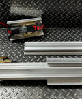 Emergency Tire Traction Aid With Extender Bars For Light Trucks To Medium Commercial Vehicles on a metal surface