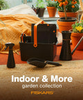 Portable Garden Tool Caddy With Locking Handle And Removable Bin, various tools in black resin, on a patio with potted plants.