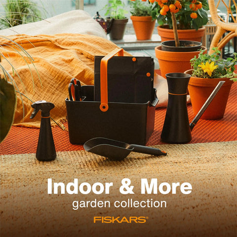 Portable Garden Tool Caddy With Locking Handle And Removable Bin, various tools in black resin, on a patio with potted plants.
