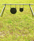 AR500 Steel Gong Target 3 Eighths Inch Thick For Precision Shooting on tripod stand in grassy field