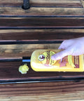 Applying Sun Shield Wood Wax With UV Protection For Outdoor Furniture Gallon to rejuvenate and protect wooden slats from sun damage.