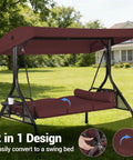 Three Seat Outdoor Porch Swing With Adjustable Canopy And Convertible Bed Two In One Patio Glider, Burgundy Red in garden setting