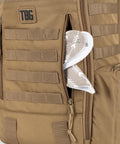 MOLLE Compatible Diaper Backpack for Dads With Built-In Changing Mat And Stroller Straps, Rugged 600D Tactical Daypack in Coyote Brown, side view with visible MOLLE webbing.