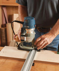 Top Shelf Router Dado Jig With CNC Machined Aluminum Carriage And One Inch Precision Bushing in use on woodworking bench.