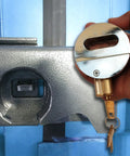 Hand holding Two And Seven Eighths Inch Beefed Up Heavy Duty Solid Steel Padlock With Hidden Shackle Hardened Reinforced Shackle.