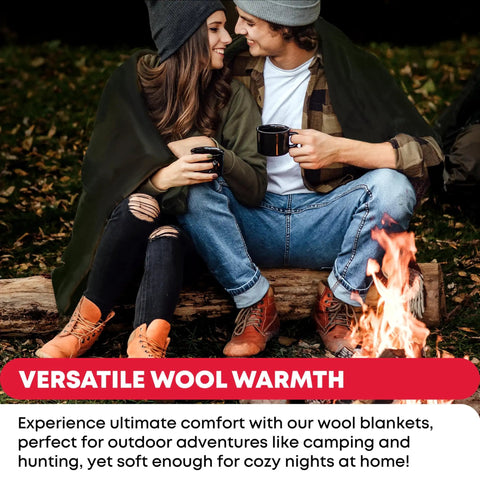 Couple wrapped in Hardcore Wool Blanket For Outdoors And Survival by a campfire, enjoying warmth, olive drab green color.