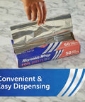 Hand pulling sheet from Reynolds Wrap box, No Fuss Pre Cut Pop Up Aluminum Foil Sheets 14 By 10.25 Inches Each Pack Of 5 50 Sheets Per Box.