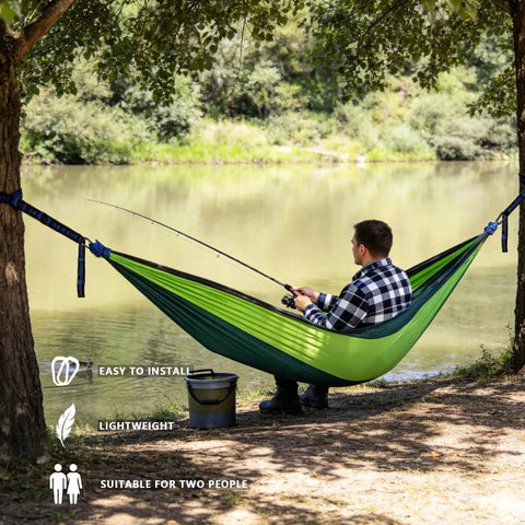 Single Portable Parachute Nylon Hammock For Outdoor Adventure with man fishing by lake, ultra durable, quick dry 210T fabric, dirt resistant