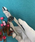 Heavy Duty Wire Cutters With Wire Stripper And Crimping Pliers 8 Inch Diagonal Cutters held against a floral backdrop