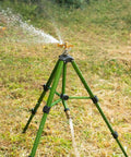 Impact Sprinkler With Tripod Base For Lawn And Garden, Pro Grade 360 Degree Coverage, Heavy Duty Brass Sprinkler Head in operation
