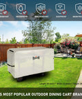 Three Shelf Pizza Oven Table With Stainless Top And Rolling Outdoor Grill Cart Waterproof Cover on grass in garden