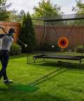 Golfer using All Around Golf Net For Hitting Practice 10x8FT Indoor Outdoor Training Net with impact target in backyard