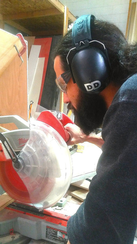 Person using power tools wearing Ultra Comfy 37 Db NRR Safety Ear Muffs For Shooting And Industry Work High Noise Reduction Earmuffs