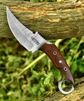 Handmade Damascus Steel Curved Fixed Blade Hunting Knife Nine Inch With Wooden Handle Ring Pommel resting on a log