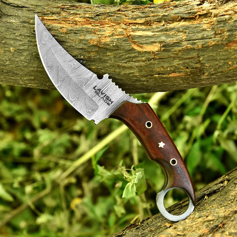 Handmade Damascus Steel Curved Fixed Blade Hunting Knife Nine Inch With Wooden Handle Ring Pommel resting on a log