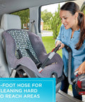 Woman using cordless car vacuum with extendable 4-foot hose and detailing kit to clean car seat, showcasing powerful suction.