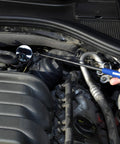 Telescoping Inspection Mirror With 2-Inch Diameter Extends Up To 28 Inches Multi-Angle Ball Joint Neck And Stainless Steel Antenna in an engine bay.