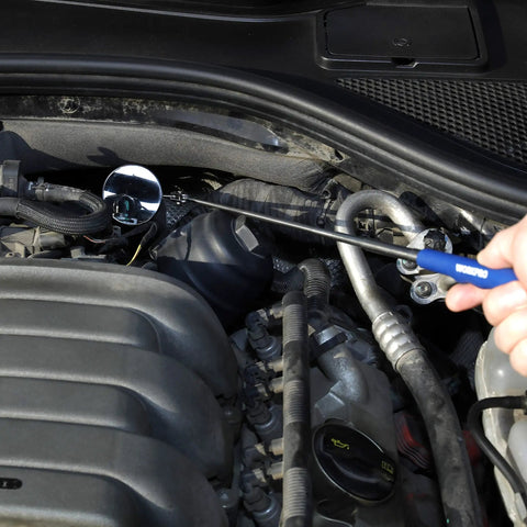 Telescoping Inspection Mirror With 2-Inch Diameter Extends Up To 28 Inches Multi-Angle Ball Joint Neck And Stainless Steel Antenna in an engine bay.