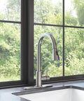 YZZY Single Handle Kitchen Sink Faucet with Pull Down Sprayer Stainless Steel Single Hole Bar Faucet High Arc Chrome installed by window.
