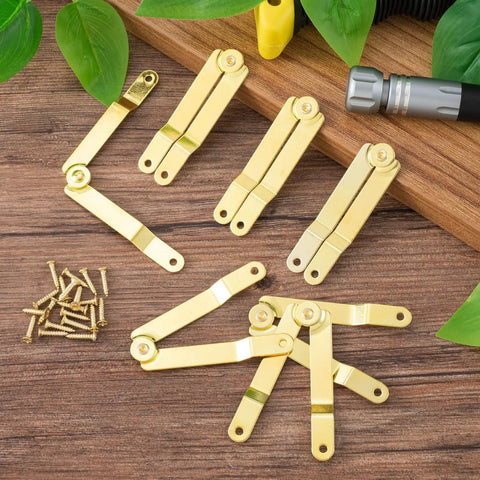 Gold Lid Support Hinge Set With 20 Screws, foldable rustproof 135-degree rotatable hinges for wooden boxes on a wooden surface.