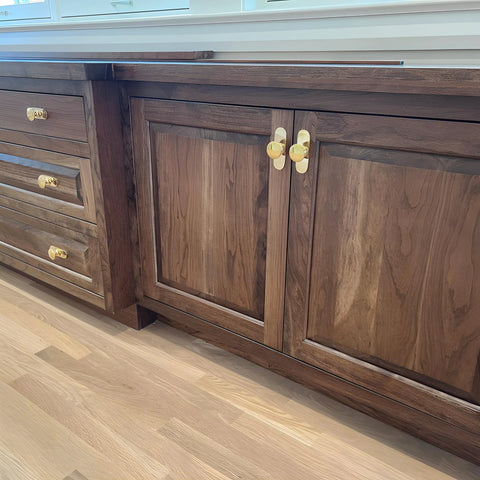 Solid Brass Cabinet Pull With Backplate, 6.5 Inch L-Shaped Handle In Polished Unlacquered Finish on wooden kitchen cabinets