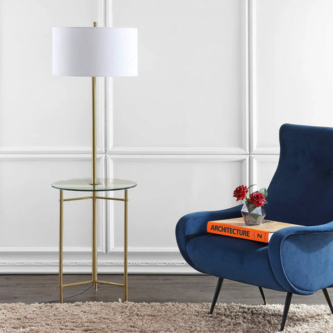 59 Inch Brass Gold Metal And Glass Side Table With Built In LED Floor Lamp beside armchair in modern living room setting
