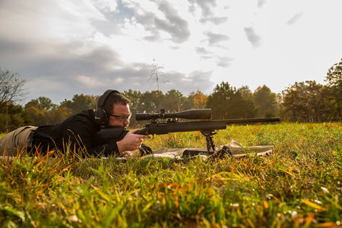 Man using Pivot Bipod 6 to 9 Inch Adjustable Notched Legs Slim Folding Design for Easy Transport, Rifle Stability, and Precision Target Shooting