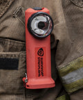 Survivor 175-Lumen Rechargeable Firefighter Right Angle Flashlight Intrinsically Safe Safety-Rated Orange without Charger clipped to jacket.