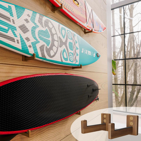 Rugged Wood Surfboard Wall Rack For Indoor Or Outdoor Use Mountable Surfboard Hanger in use, displaying boards in a room.