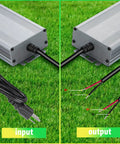 AC to DC Transformer 400 Watts IP67 Waterproof LED Driver with input power cord and output wires on grass