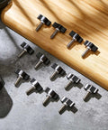 Top Shelf Stainless Steel Thumb Screws With Wings Knobs For Shop Projects 16 Pack laid out on a work surface with tools.