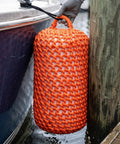 Solid Nylon Boat Fenders For Docking And Marine Anti Collision Protection shown cushioning a boat against a dock