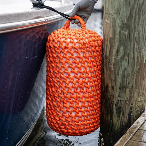 Solid Nylon Boat Fenders For Docking And Marine Anti Collision Protection shown cushioning a boat against a dock