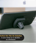 Black Rock Solid Magnetic Car Phone Holder With Kickass Magnet for iPhone and Android, serving as a kickstand on a desk.