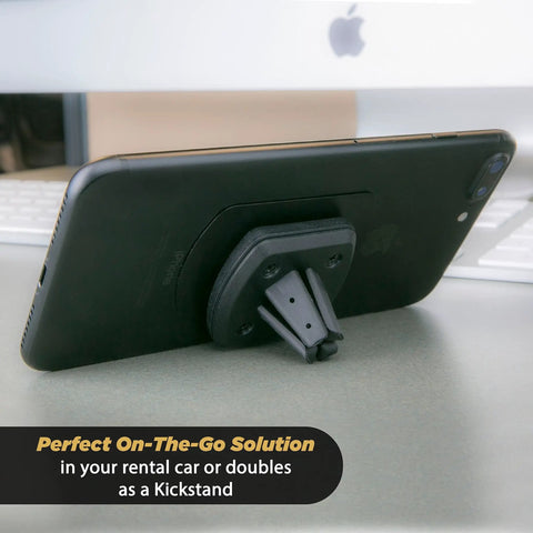 Black Rock Solid Magnetic Car Phone Holder With Kickass Magnet for iPhone and Android, serving as a kickstand on a desk.