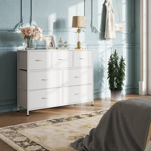 Seven Drawer Dresser And TV Stand With Wood Top, Fabric Storage Tower, White, Sturdy Steel Frame in elegant bedroom setting.