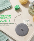 TEHAUX Silicone Bathtub Drain Stopper 15cm with playful tractor design on a countertop for bathroom use.