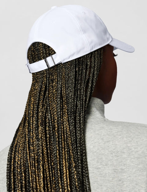 Back view of Unstructured Swoosh Cap White On White Casual Baseball Hat Small Medium Fit Lightweight Everyday Headwear for Men And Women.