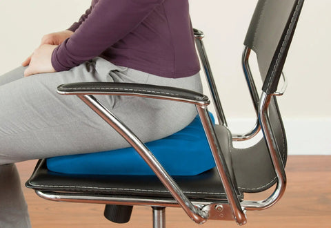 Teeter Core Restore Inflatable Lumbar Support Cushion For Back Pain Relief And Posture Correction on a modern office chair.