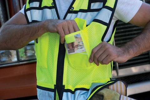 Rock Solid Hi Vis Surveyor Vest With Zipper Front Closure Ansi Class Two Type R Certified Lime Polyester Reflective Safety Vest Featuring Kickass Stripes And Hefty Tool Pockets For Xl, showing pocket use.