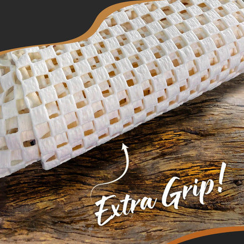 Close-up of PVC non slip rug pad roll with open weave design for extra grip on hardwood surfaces, labeled 'Extra Grip!'