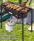 High Pressure Propane Outdoor Cooking Grill Burner For Camping And Backyard BBQs With CSA Regulator 0 To 20 PSIG And 4 Ft Gas Hose Dual Cast Iron Burners in use at outdoor event with food grilling.
