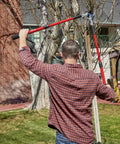 Person using Extendable Handles Compound Action Bypass Lopper For Thick Branches Up To One And A Half Inches in yard