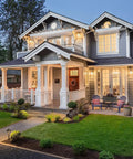 A well-lit yard with Solid Brass Pathway Lights 2 Pack Low Voltage Landscape Walkway Lighting enhancing a classic home.