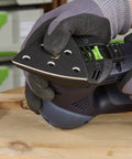 StickFix Hard Sanding Pad For DX 93 System in use, triangular pad with equal angle corners and convex edges on wood surface