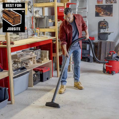 Man using Beast Tough Heavy Duty Wet Dry Vac Attachment Kit For One Seven Eighths Inch Hoses Pro Grade Shop Vacuum in workshop